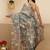 Teal printed tissue traditional saree with blouse piece