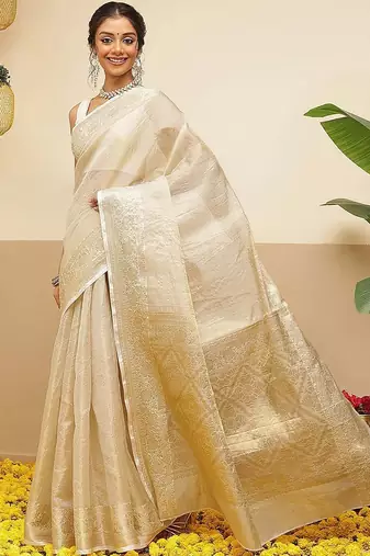 Off white woven tissue party wear saree with blouse piece