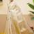 Off white woven tissue party wear saree with blouse piece