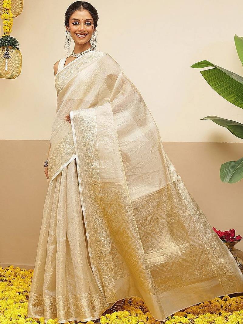 Off white woven tissue party wear saree with blouse piece