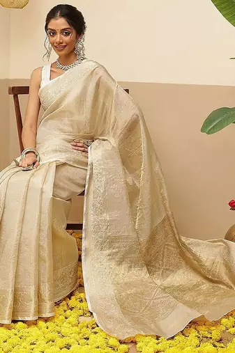 Off white woven tissue party wear saree with blouse piece