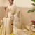 Off white woven tissue party wear saree with blouse piece