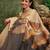 Beige printed tissue traditional saree with blouse piece