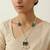 The emerald bloom long necklace