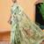 Green printed cotton blend ethnic saree with blouse piece