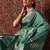Green printed art silk ethnic saree with blouse piece