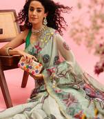 Green printed cotton blend ethnic saree with blouse piece