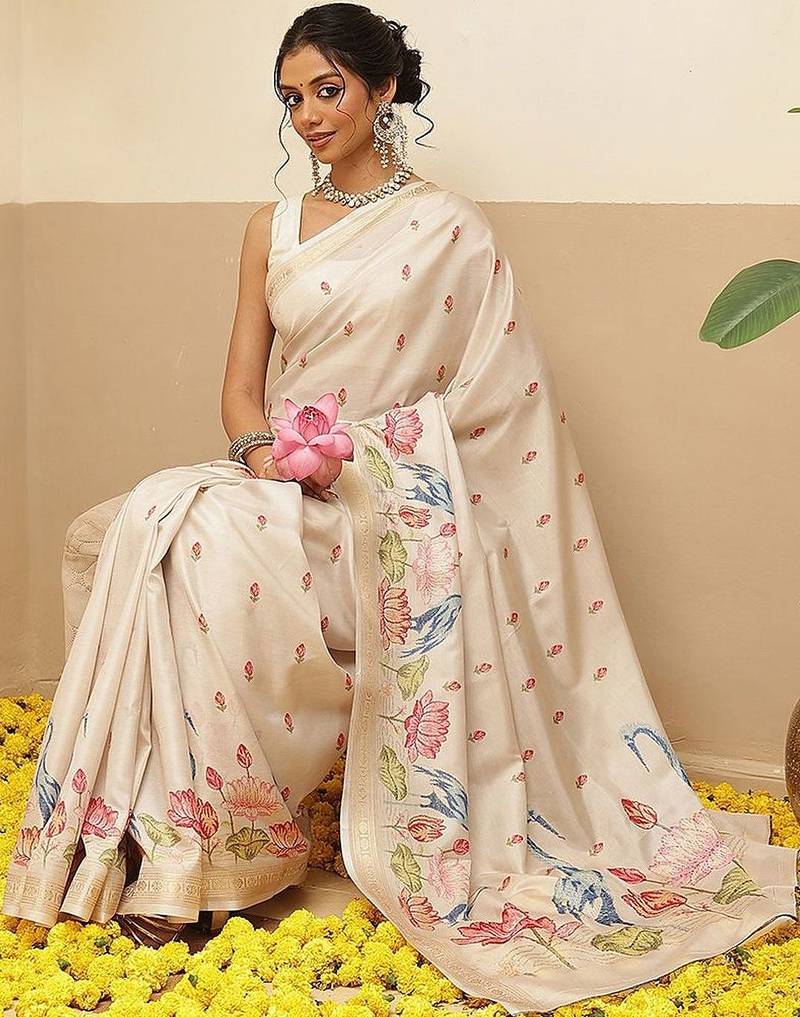 Cream ethnic motifs embroidered art silk festive saree with blouse piece