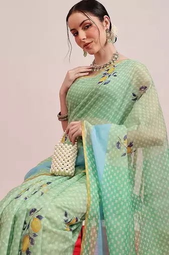 Green printed cotton blend ethnic saree with blouse piece