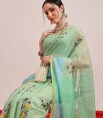 Green printed cotton blend ethnic saree with blouse piece