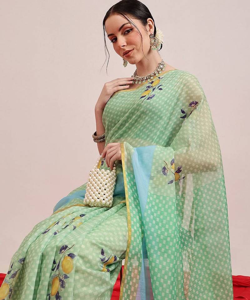 Green printed cotton blend ethnic saree with blouse piece