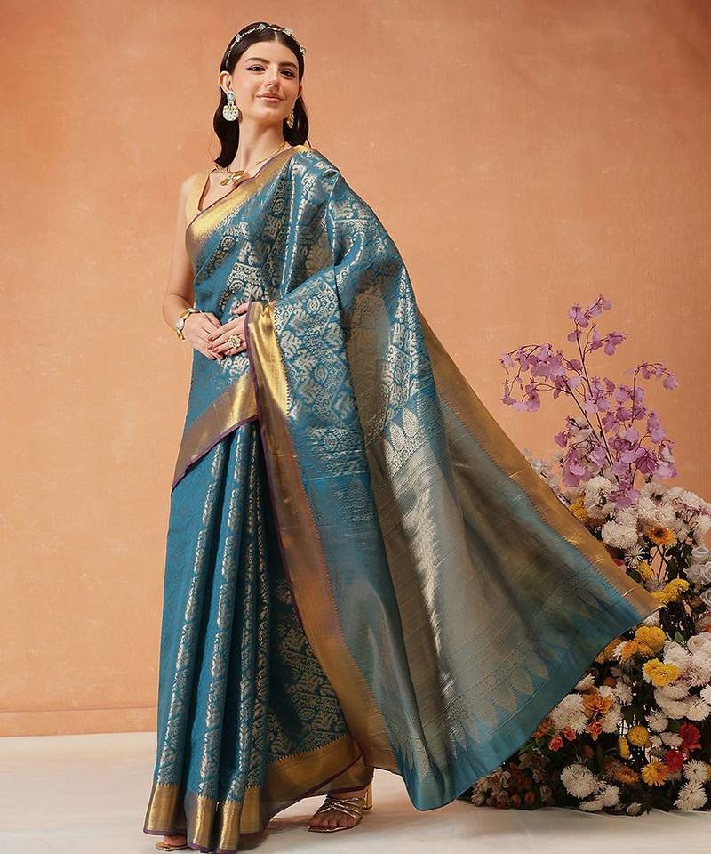 Teal woven silk blend ethnic saree with blouse piece