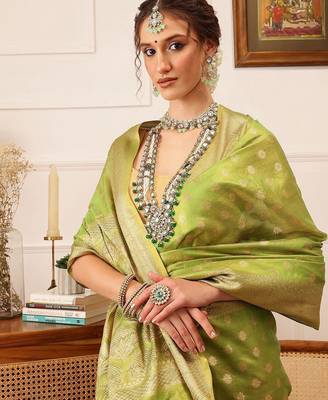 Green woven tissue party wear saree with blouse piece 1