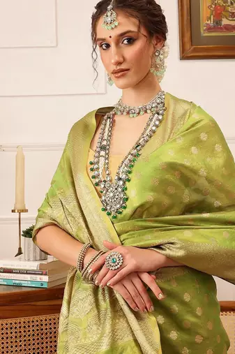 Green woven tissue party wear saree with blouse piece