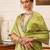 Green woven tissue party wear saree with blouse piece