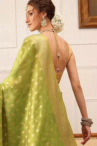 Green woven tissue party wear saree with blouse piece
