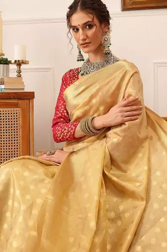 Beige woven tissue party wear saree with blouse piece