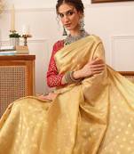 Beige woven tissue party wear saree with blouse piece