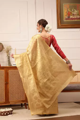Beige woven tissue party wear saree with blouse piece