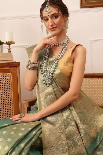 Teal woven tissue party wear saree with blouse piece