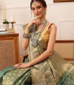 Teal woven tissue party wear saree with blouse piece