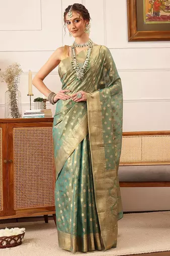 Teal woven tissue party wear saree with blouse piece