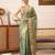 Teal woven tissue party wear saree with blouse piece