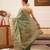 Teal woven tissue party wear saree with blouse piece