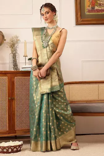 Teal woven tissue party wear saree with blouse piece