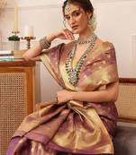 Purple woven tissue party wear saree with blouse piece