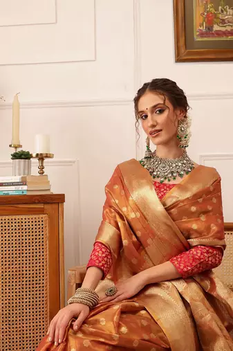 Peach woven tissue party wear saree with blouse piece