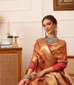 Peach woven tissue party wear saree with blouse piece