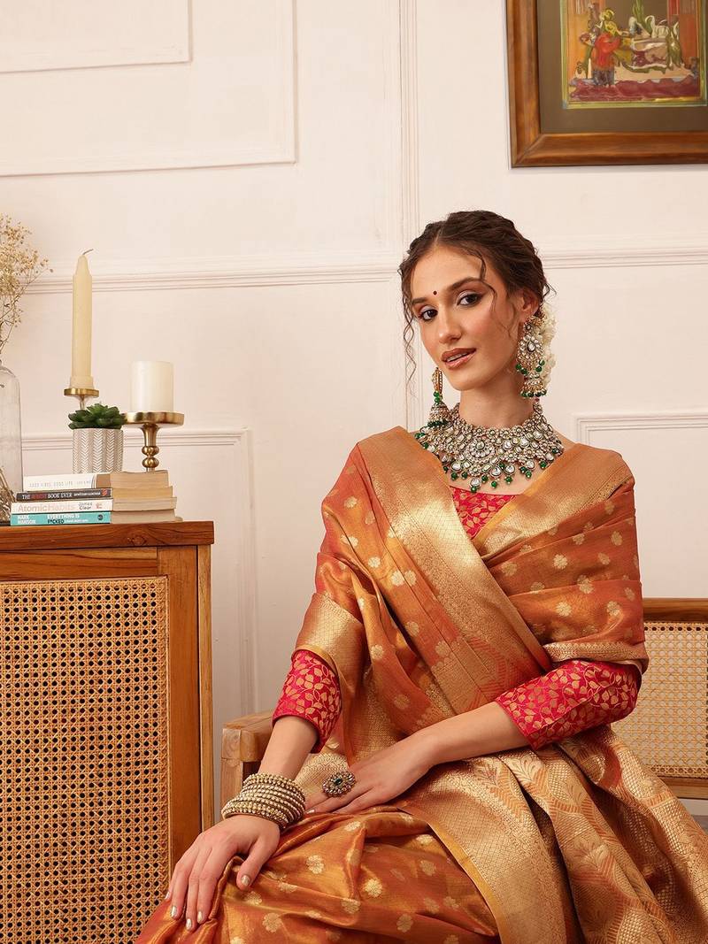 Peach woven tissue party wear saree with blouse piece
