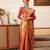 Peach woven tissue party wear saree with blouse piece
