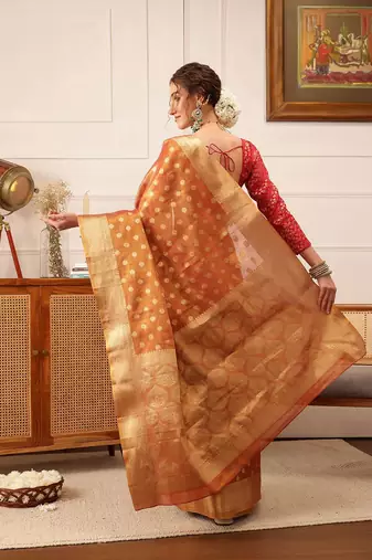 Peach woven tissue party wear saree with blouse piece