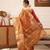 Peach woven tissue party wear saree with blouse piece