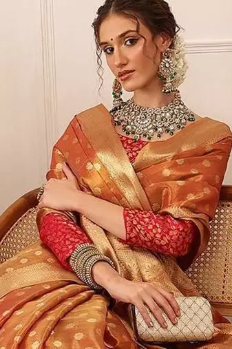 Peach woven tissue party wear saree with blouse piece