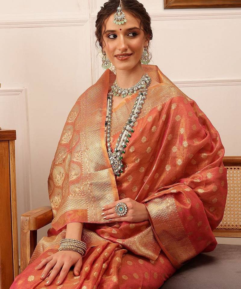 Pink woven tissue party wear saree with blouse piece