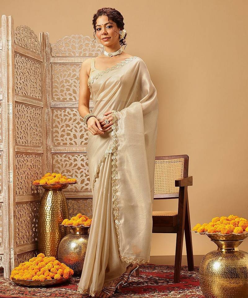 Beige plain silk cotton party wear saree with blouse piece
