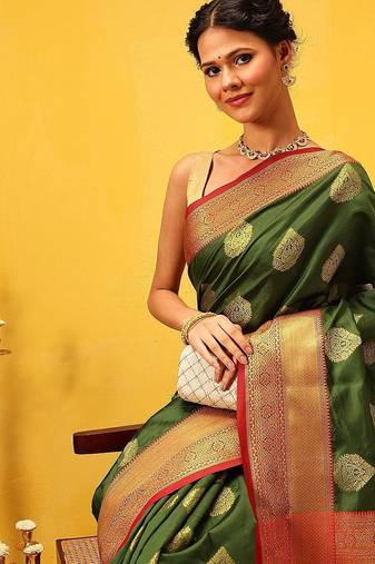 Green woven silk blend ethnic saree with blouse piece