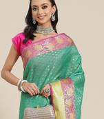 Green woven art silk traditional saree with blouse piece