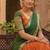 Vibrant Orange and Green Traditional Silk Lehenga Set with Intricate Zari Weaving