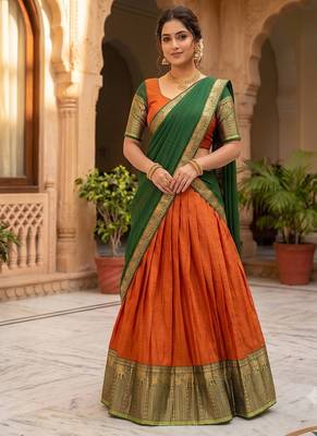 Vibrant Orange and Green Traditional silk blend Lehenga Set with Intricate Zari Weaving 3