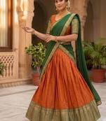 Vibrant Orange and Green Traditional Silk Lehenga Set with Intricate Zari Weaving