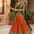 Vibrant Orange and Green Traditional Silk Lehenga Set with Intricate Zari Weaving