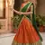 Vibrant Orange and Green Traditional Silk Lehenga Set with Intricate Zari Weaving