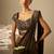 Muted olive green embroidered shimmer crepe pre draped saree set