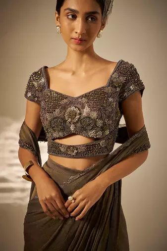 Muted olive green embroidered shimmer crepe pre draped saree set