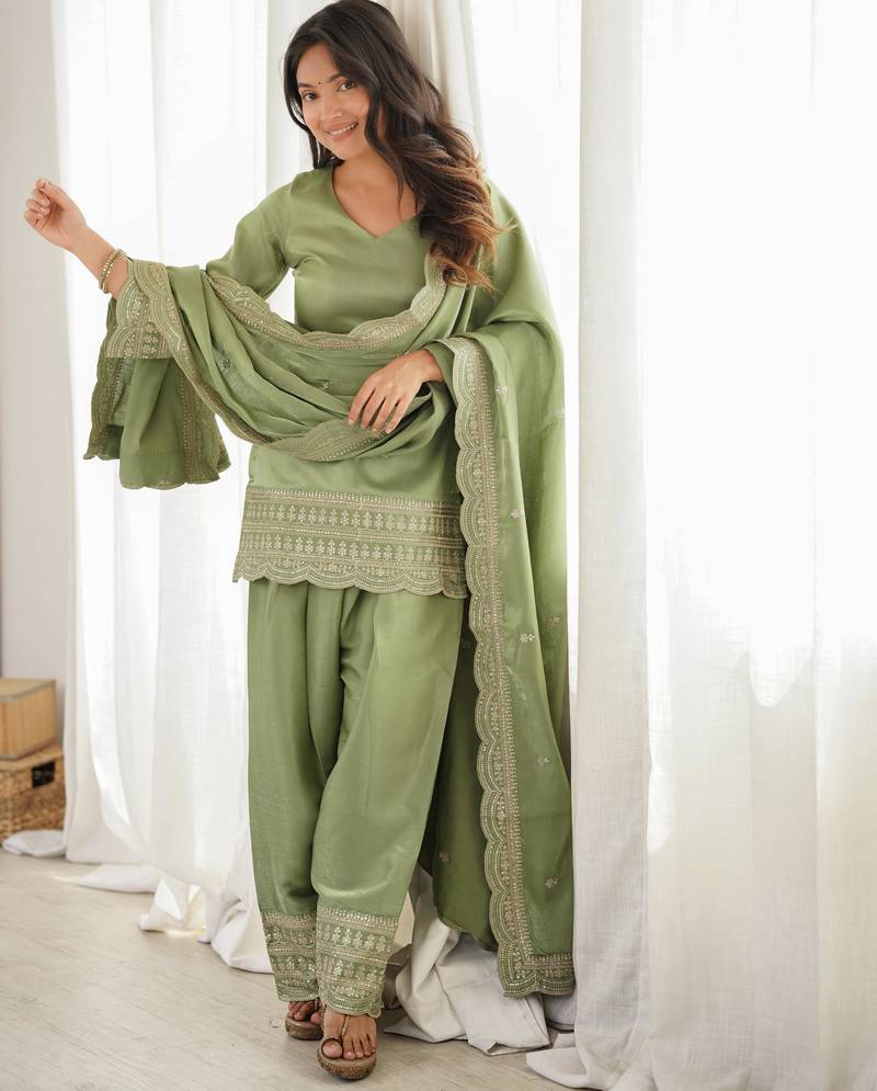 Women's sage green festive suit set with intricate embroidery