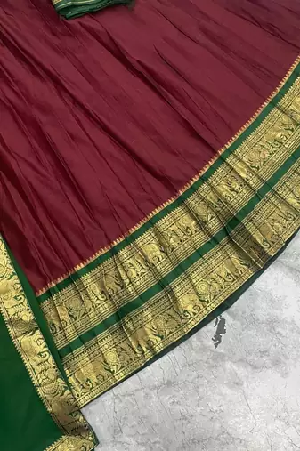 Maroon Kanci cottan blend half saree with traditional gold zari weaving work 